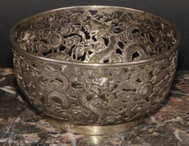 A Chinese silver bowl, pierced and chased with dragons amongst scrolling clouds, 11cm diameter,