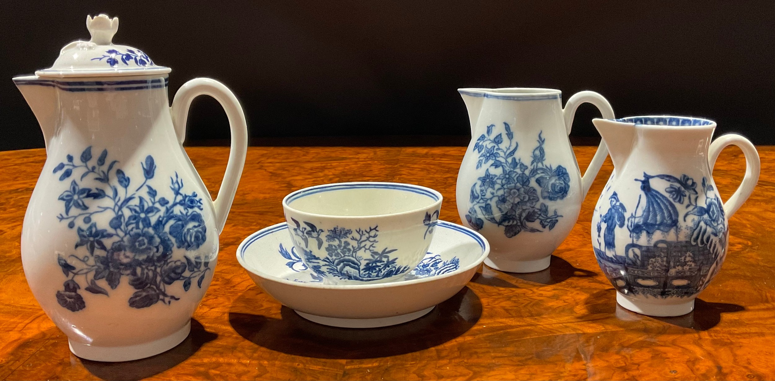 A Caughley Three Flowers pattern sparrow beak jug and cover, decorated in underglaze blue, flower