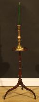 A 19th century mahogany tripod candle stand, dished circular top, turned column, downswept legs,