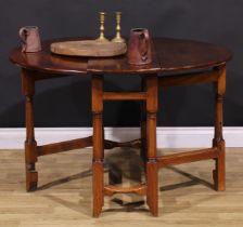 A 17th century style fruitwood gateleg table, oval top with fall leaves, turned and blocked