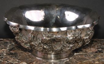 A large Japanese silver lotus shaped bowl, chased with lilies on a planished ground, 31.5cm diam,