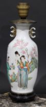 A Chinese ovoid vase, painted in polychrome with ladies of the court, in a garden, verse to verso,