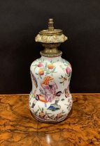 A Chinese porcelain waisted gourd shaped vase, mounted as a table lamp, decorated in the famille