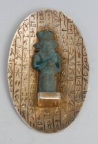 Antiquities - an Egyptian silver brooch, incorporating an Ancient turquoise faience votive or