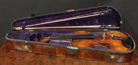 A violin, the one-piece back 35.5cm long excluding button, ebony tuning pegs, 60cm long overall, the