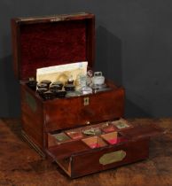 A 19th century mahogany apothecary cabinet, hinged cover enclosing an arrangement of chemist's