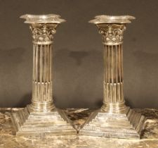 A pair of Edwardian silver stop-fluted Corinthian column candlesticks, 16.5cm high, Martin, Hall &
