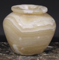 An Egyptian alabaster ovoid jar, 16cm high