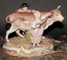 A Meissen porcelain figure group, of a boy and girl with a bull, 22cm wide, incised R78, numbered
