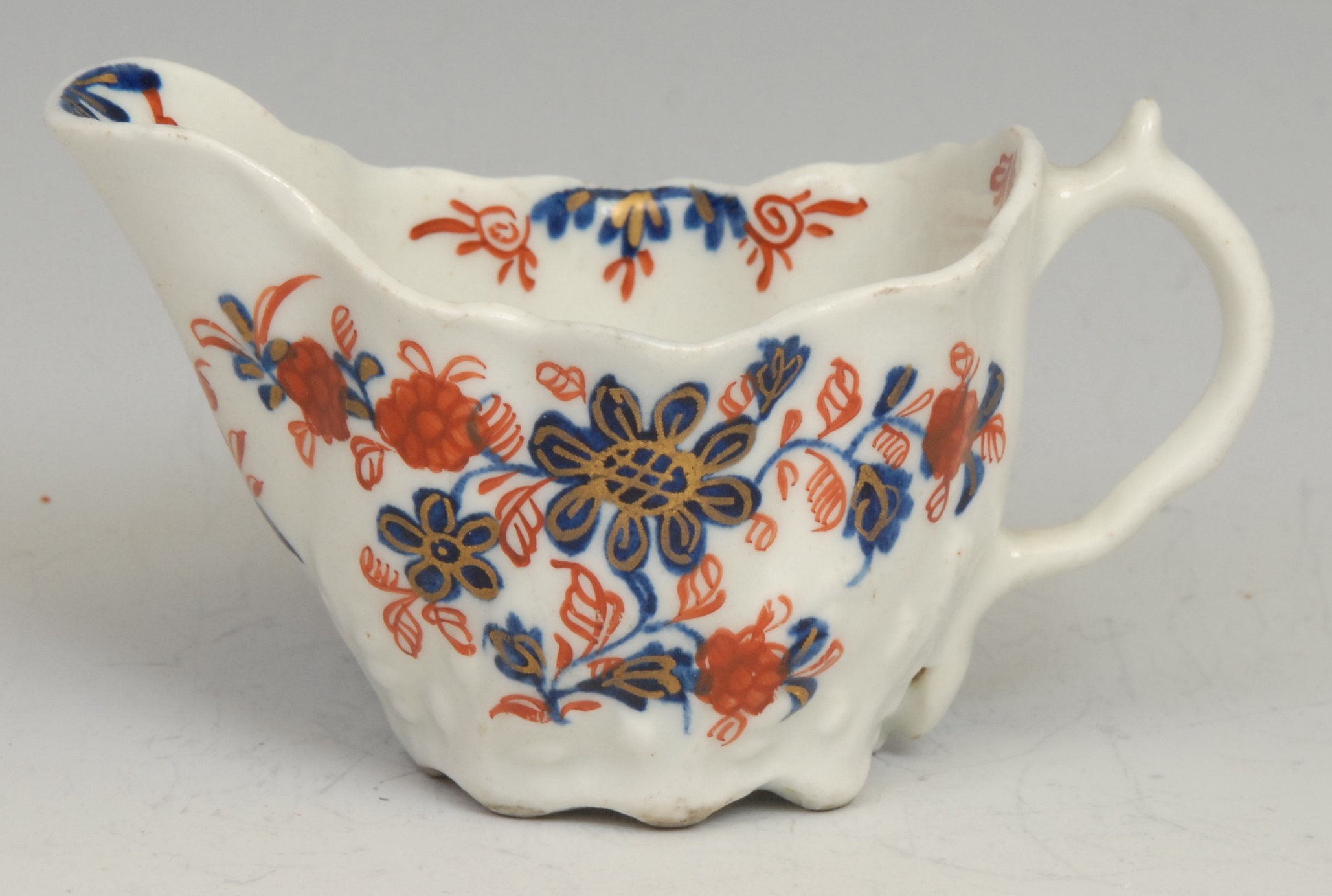 A Lowestoft Low Chelsea ewer, decorated in underglaze blue and overglaze red with flowers and - Image 2 of 3