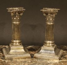 A pair of Edwardian silver stop-fluted Corinthian column candlesticks, 14.5cm high, Hawksworth, Eyre