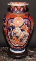 A Japanese ovoid vase, decorated in the Imari palette with birds, landscapes and floral motifs,