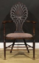 An Art Nouveau mahogany boudoir chair, shaped back pierced and carved as an anthemion, stuffed-
