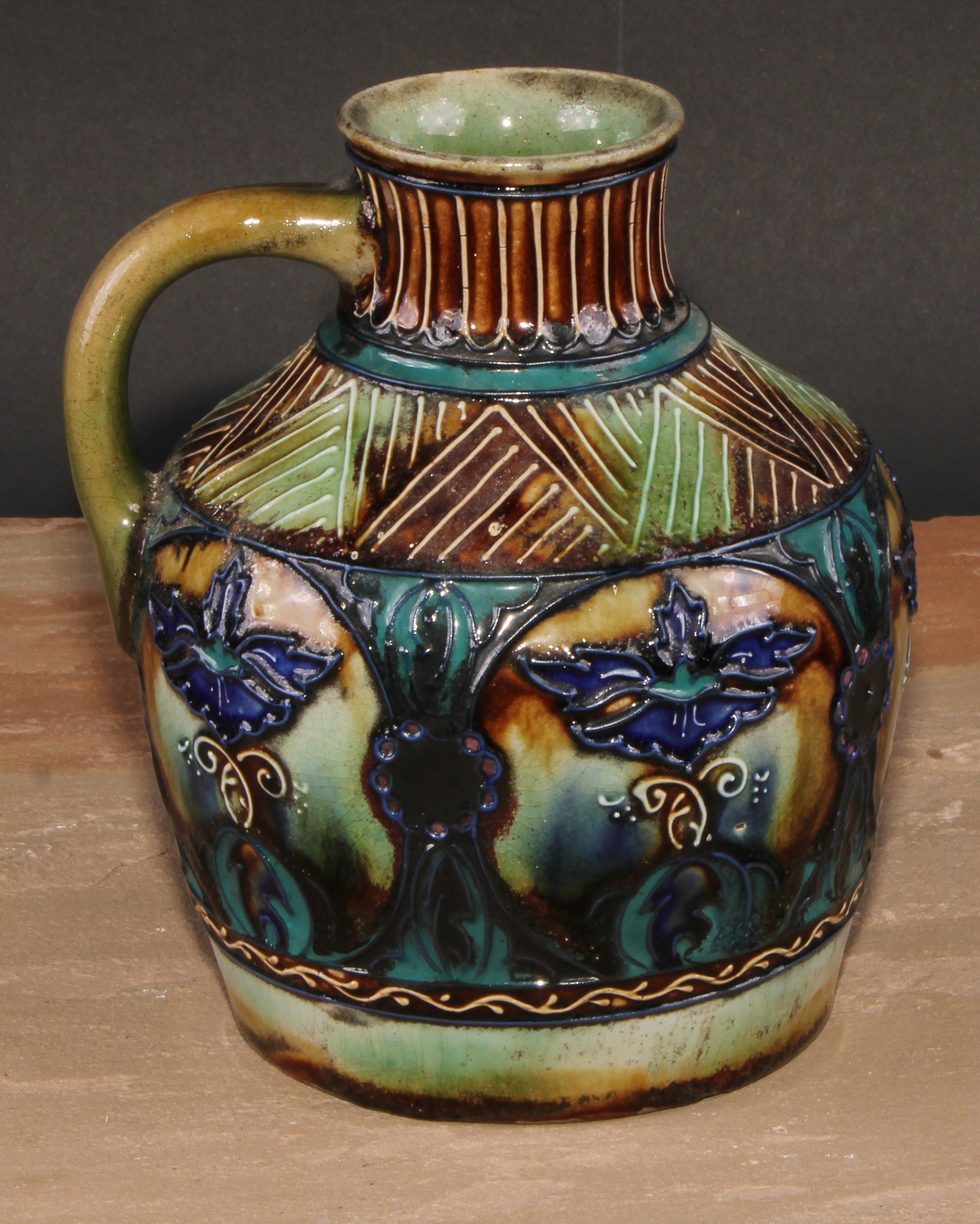 A Denby Contemporary tubelined single handled ovoid vase, decorated with stylised floral motifs