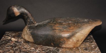 Folk Art -a North American/Canadian carved and painted decoy duck, as a goose, the full-bodied