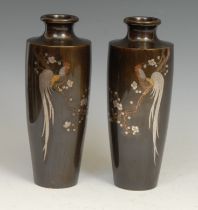 A pair of Japanese bronze and ovoid vases, each inlaid in silver and mixed metals with cockerels