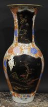 A large Japanese porcelain ovoid vase, decorated with lacquer panels on a ground of flowers and