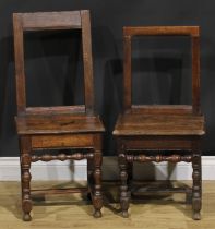 A harlequin pair of 18th century oak backstools, boarded seats, H-stretchers, the largest 85.5cm