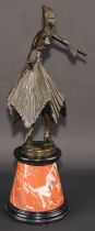 An Art Deco style dark patinated bronze, after Demétre Chiparus, dancing girl in cap with swirling