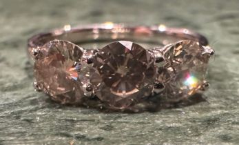 A diamond ring, linear set with three certified round brilliant cut diamonds, total diamond
