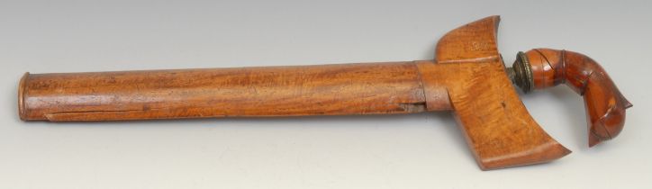 An Indonesian kris, 33.5cm wavy blade with pronounced pamor, hardwood hulu carved as a stylised