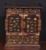 A Japanese menuki mounted elm chatanzu or table-top shodana, incorporating a pair of panel doors and