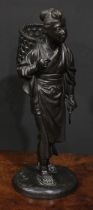 Japanese School (Meiji period), a dark patinated bronze, of a young girl returning from the