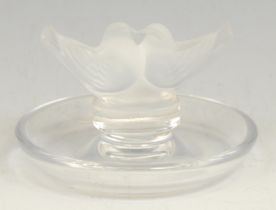 A Lalique Lovebirds ring tray, applied with a pair of frosted glass birds in an embrace, 6cm high,
