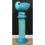 A Burmantofts faience turquoise glaze jardiniere and pedestal, as a nautilus shell on a naturalistic