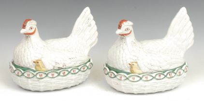 A 19th century pottery novelty egg basket, as a chicken and chicks on a nest, picked out in tones of