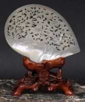 A Chinese mother of pearl shell, pierced and carved in the Cantonese manner with birds and the Three