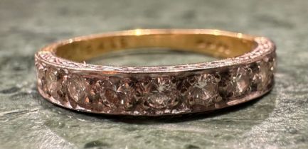 A diamond half eternity ring, linear set with ten round brilliant cut diamonds, total estimated