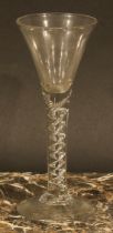 A George III air twist drinking glass, trumpet shaped bowl, double helix twist stem, domed