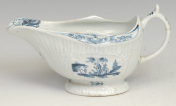 A Lowestoft Little Fisherman pattern strap fluted sauce boat, decorated in underglaze blue within