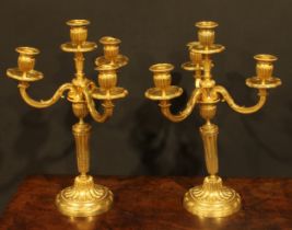 A pair of Louis XVI Revival gilt bronze four-light candelabra, by H. Voisenet, 61 Rue De Turenne,