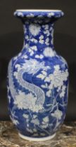 A Chinese ovoid vase, painted in tones of underglaze blue with dragons amogst peonies and foliage,