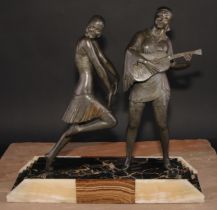 In the manner of Enrique Molins-Balleste, a French Art Deco spelter group, Musician and Dancer,