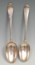 A matched pair of George III Irish silver Hanoverian pattern table spoons, 22.5cm long, Dublin