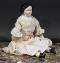 An early 20th century German porcelain doll, painted features, linen body, lace dress, 41cm long