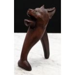 Nutcrackers - a Black Forest novelty lever-action nut cracker, carved as the head of a dog, glass