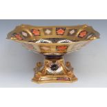 A Royal Crown Derby Imari palette 1128 pattern shaped square pedestal comport, dolphins to angles,