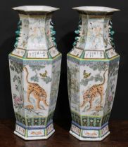 A pair of Chinese hexagonal vases, painted in polychrome with tigers, water buffalo and other