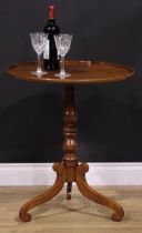 A 19th century mahogany tripod occasional table, one-piece dished circular top, turned column,