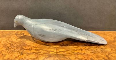 A painted softwood avian decoy, carved as a pigeon, 36cm long