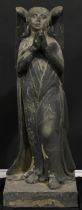 A late Medieval style carved stone figure, of a praying angel, 114cm high, the base 43cm square