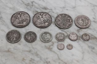 Coins - A Victorian silver crown, 1895; another, 1896; a Victorian silver half crown; a Victorian