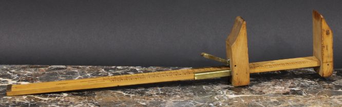 An early 20th century brass mounted boxwood foot measure, marked out with English and French