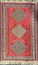 An Uzbek design Bukhara type wool rug or carpet, worked in the traditional manner, 201cm x 121cm