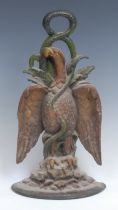 A Victorian polychrome painted cast iron door stop or porter, as an eagle and serpent, demi-lune