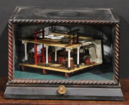 A 20th century, rotating nautical diorama - cross section of a gun deck cased in an ebonised